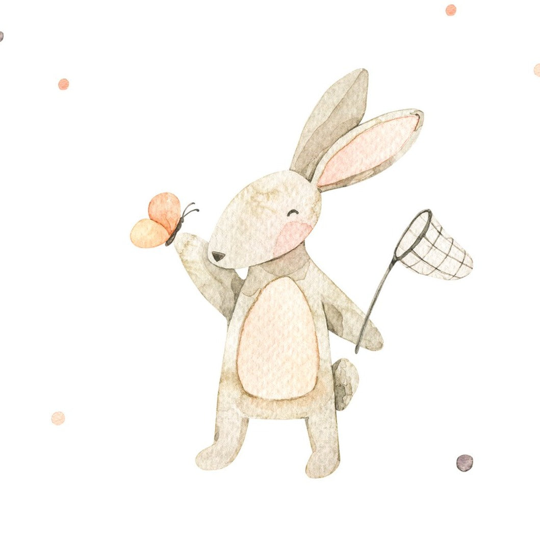 A playful watercolor bunny standing upright, cheerfully chasing a butterfly with a net. The bunny is painted in light gray tones with soft pink inner ears, set against a white background with scattered color dots, conveying a scene of joy and playfulness.