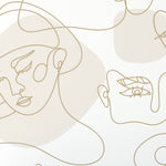 A close-up view of the wallpaper roll with golden line drawings of abstract faces on a white backdrop. The roll is partially unrolled, displaying the elegant and flowing artwork that covers the paper.