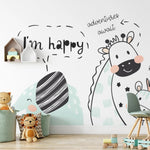 A vibrant children's room wall mural, Kids Wallpaper - Animal Mural II, with playful cartoon animals like a smiling giraffe, a friendly lion, and a cheeky crocodile. Words like 'adventures await' and 'roar' bubble around them, encouraging a playful and imaginative atmosphere.