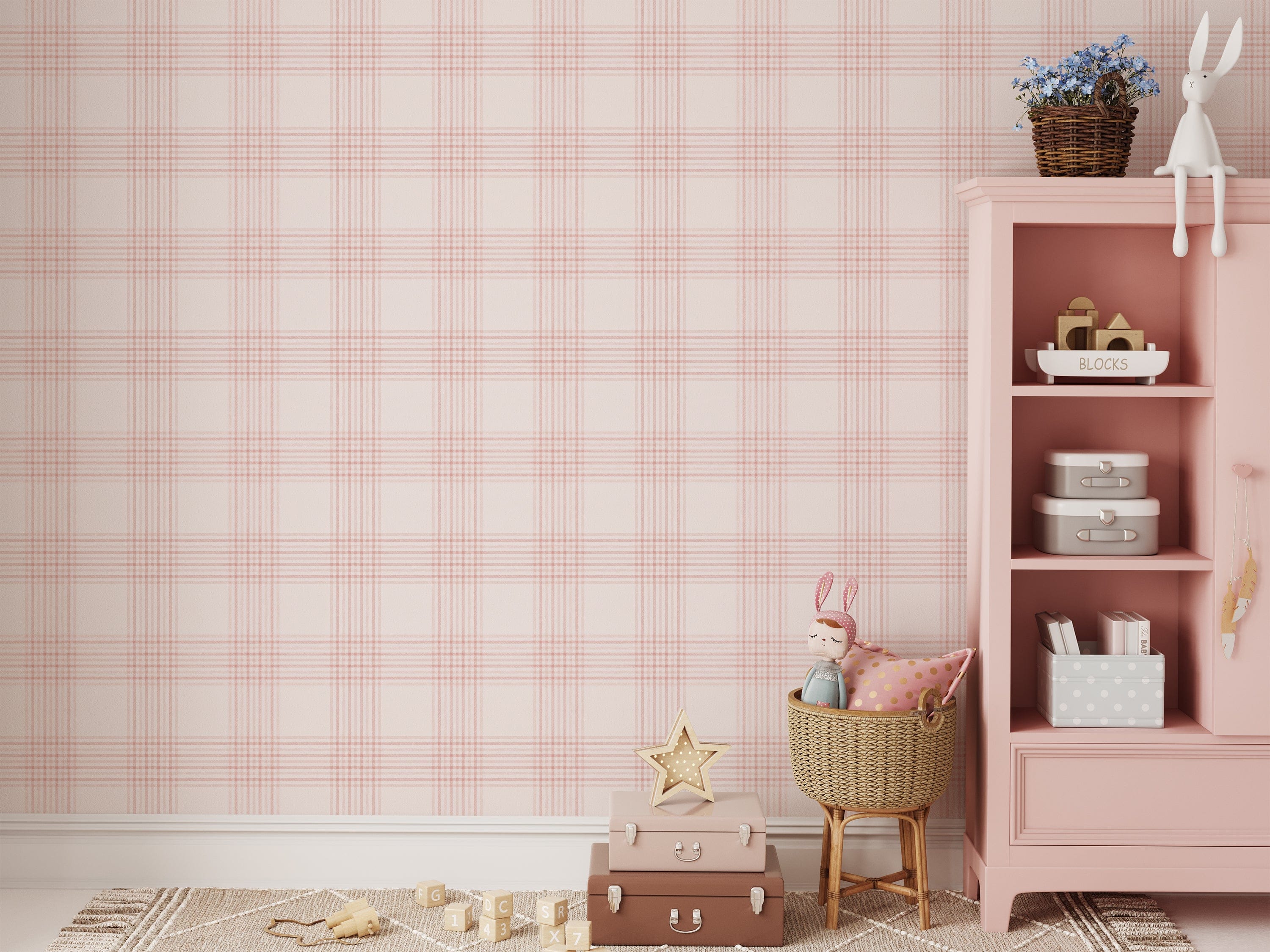A cozy nursery with a pink bookshelf and children's toys against a wall covered in pink plaid wallpaper. The wallpaper features a soft pink and white checkered pattern, creating a warm and welcoming atmosphere. The bookshelf holds books, baskets, and a stuffed bunny, enhancing the playful and charming look of the room.