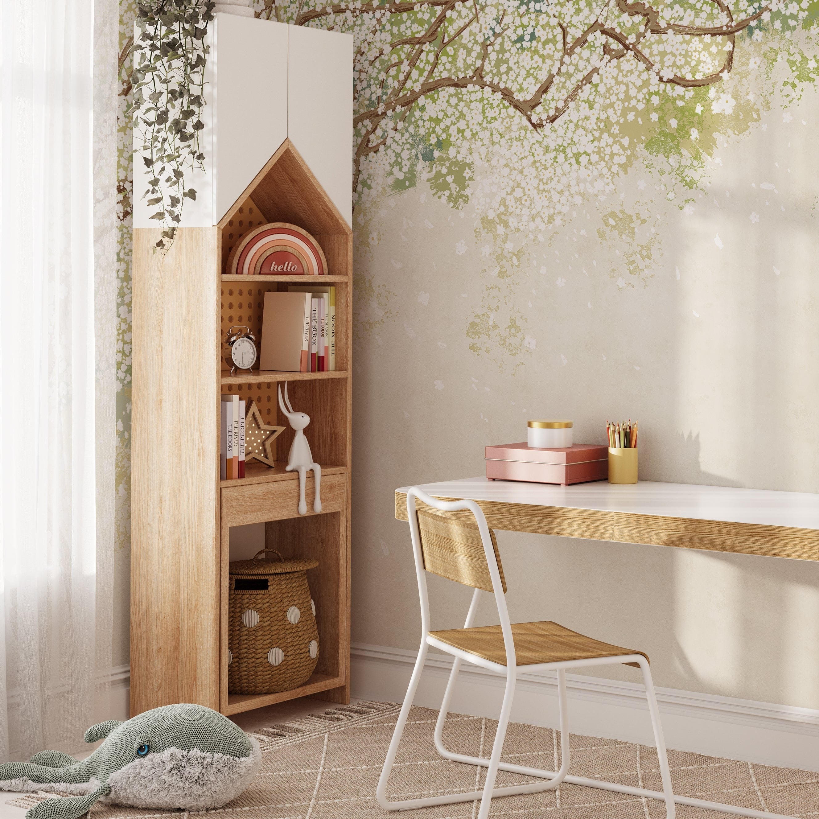 A well-organized study nook with a wooden desk, chair, and a tall bookshelf against a wall featuring the Sakura Serenade mural wallpaper. The wallpaper's design of cherry blossom branches with white flowers on a soft green and beige background adds a serene and elegant ambiance to the space.