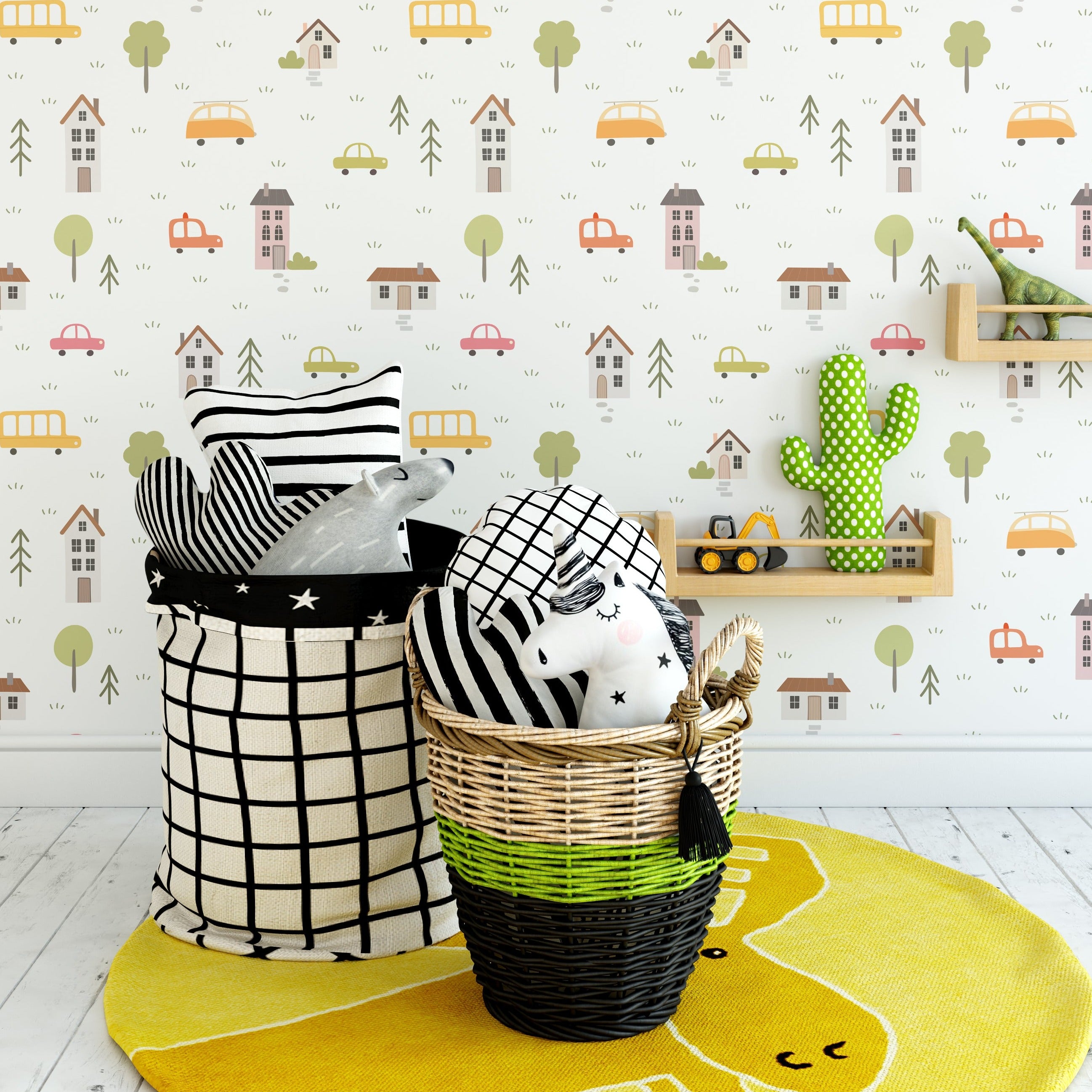 Children's playroom with School Bus Wallpaper, displaying a fun and lively pattern of colorful cars, buses, houses, and trees, complemented by decorative pillows and toys.