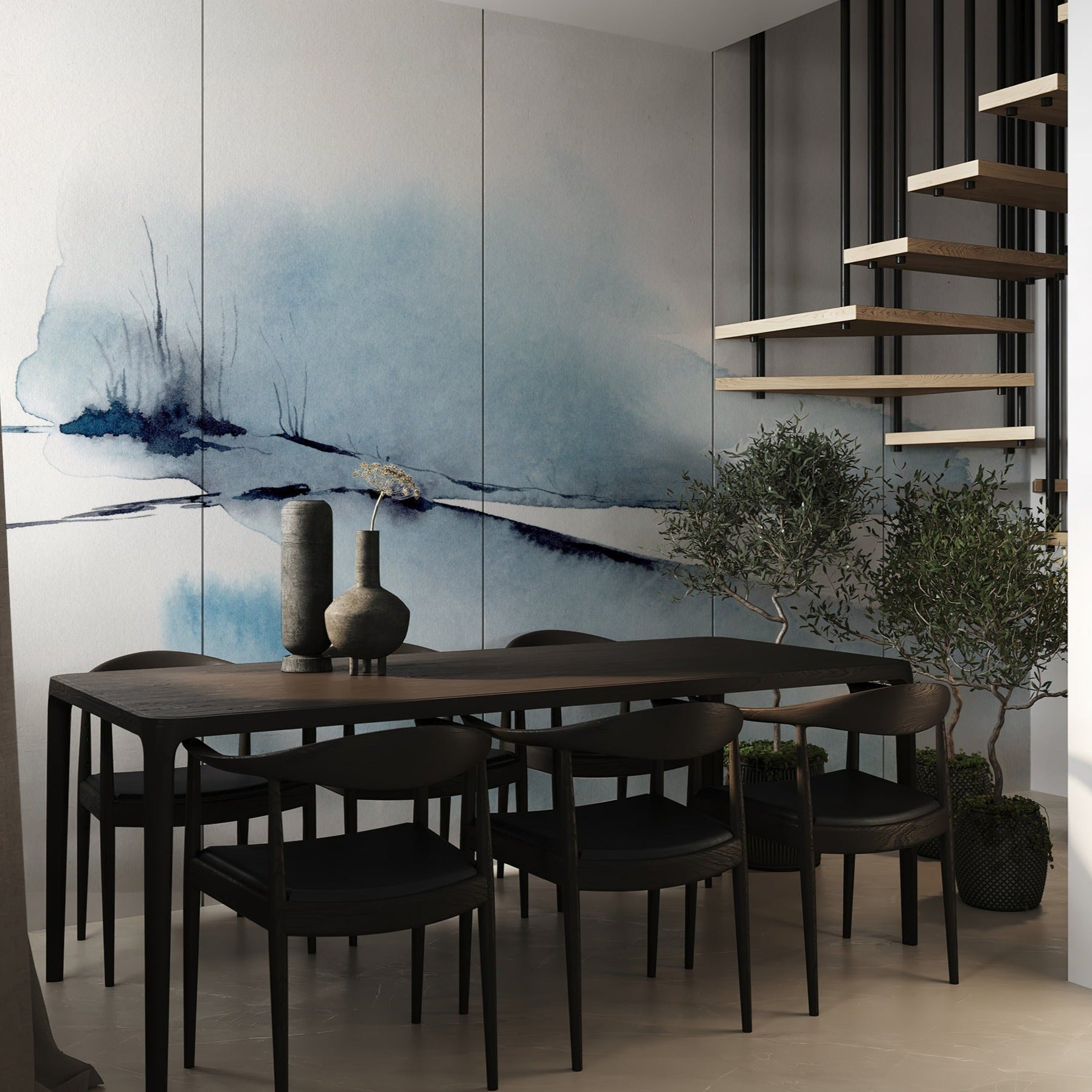 An elegant dining room features the "Atmospheric Sky" wall mural, depicting a tranquil watercolor scene with flowing blue tones and subtle black accents. The artwork extends the entire wall, providing a dramatic backdrop to the modern dark wood dining table and chairs, enhancing the contemporary aesthetic of the space.