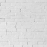 A close-up view of the Realistic White Brick Wallpaper, highlighting its textured surface that mimics the look and feel of actual brickwork. The wallpaper’s white hues and shadowing effects provide a sense of authenticity and urban chic, perfect for adding an architectural element to any interior design.