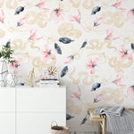 Elegant interior with Gold Snake Wallpaper featuring pink flowers and golden snakes on white background