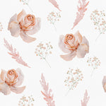 A detailed view of pastel watercolor floral wallpaper featuring soft, delicate roses in shades of peach and pink, interspersed with sprigs of baby's breath and feathery leaves on a white background.
