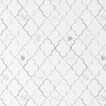 Close-up view of 'Moroccan Tile Wallpaper VII - Steel Grey' showcasing an elegant steel grey and white Moroccan tile pattern, with subtle floral accents for a chic and timeless design.