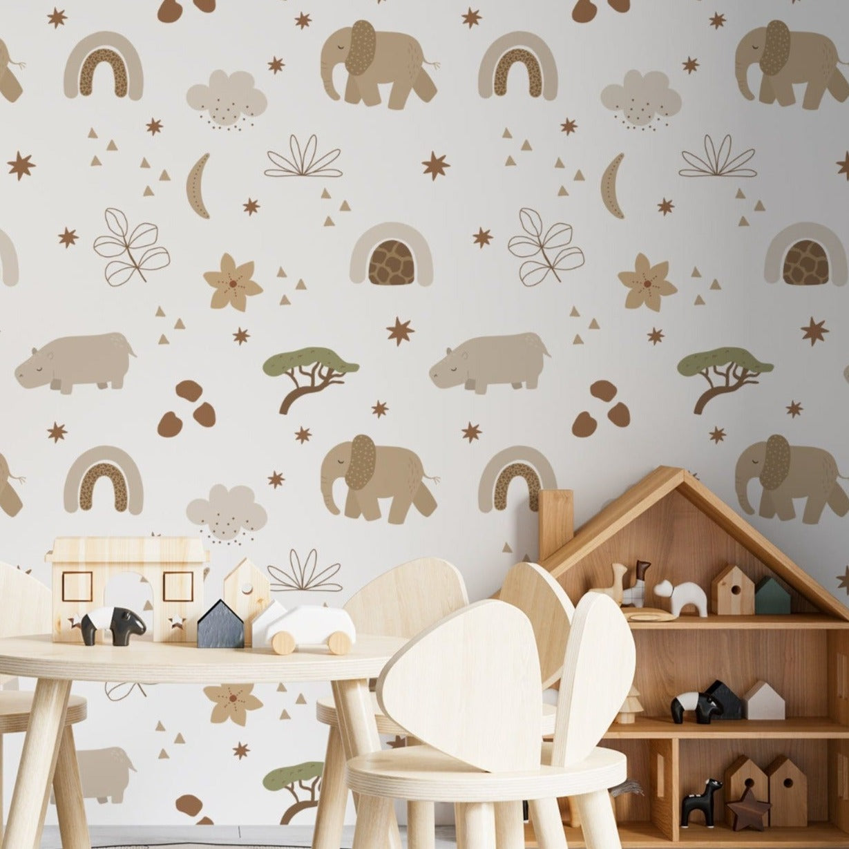 A kids’ playroom showcasing the Safari Animals Kids Wallpaper III with adorable elephants, hippos, and other gentle animals in muted tones on a white backdrop. The space is styled with a wooden children’s table set and animal-shaped shelves, creating an inspiring and educational environment