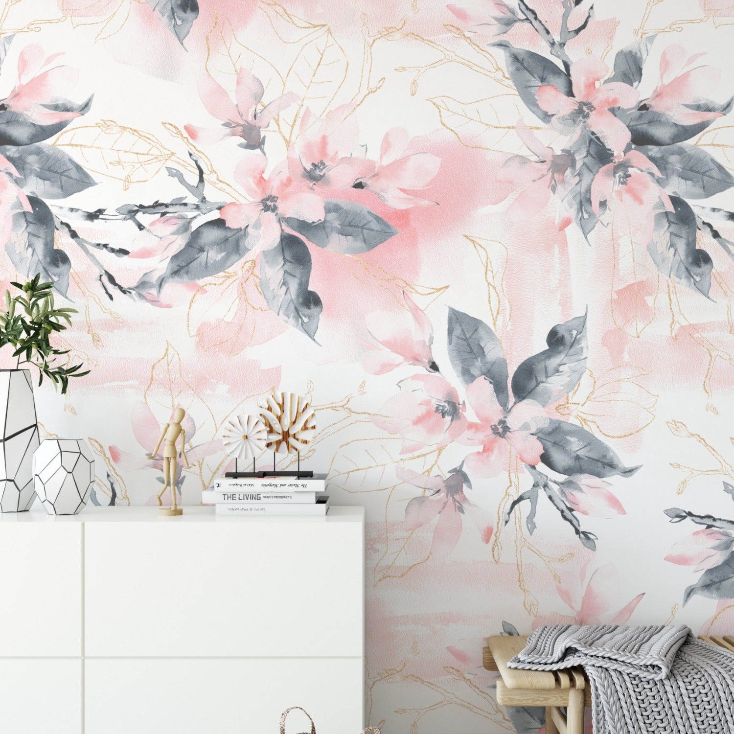 Interior design featuring the Elegant Wisdom Wallpaper VIII with light pink blossoms and golden branches over gray foliage, complementing a modern white and neutral toned room with stylish decor.
