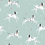 Fun and playful wallpaper featuring white Dalmatian dogs in various running poses on a soft mint green background. Each dog is adorned with black spots, and the scene includes small red hearts and white dots scattered throughout, adding a whimsical touch.