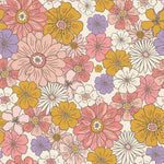 A close-up view of the Retro Groovy Flower Wallpaper featuring a dense pattern of vibrant, multicolored flowers in shades of pink, yellow, and purple against a neutral background.