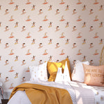 A child's bedroom decorated with the 'Surf's Up! Kids Wallpaper,' showcasing joyful young surfers on colorful boards, enhancing the room's lively and adventurous theme.