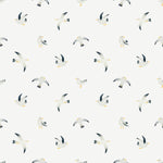 Close-up view of the Birds By the Sea Wallpaper, displaying a charming pattern of seagulls in various poses of flight. The background is a soft white, with the birds detailed in gray, black, and yellow, conveying a sense of freedom and seaside atmosphere.
