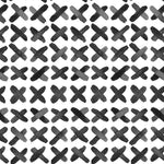 Close-up view of X Infinity Boho Wallpaper displaying a striking black and white geometric cross pattern for a contemporary bohemian style.