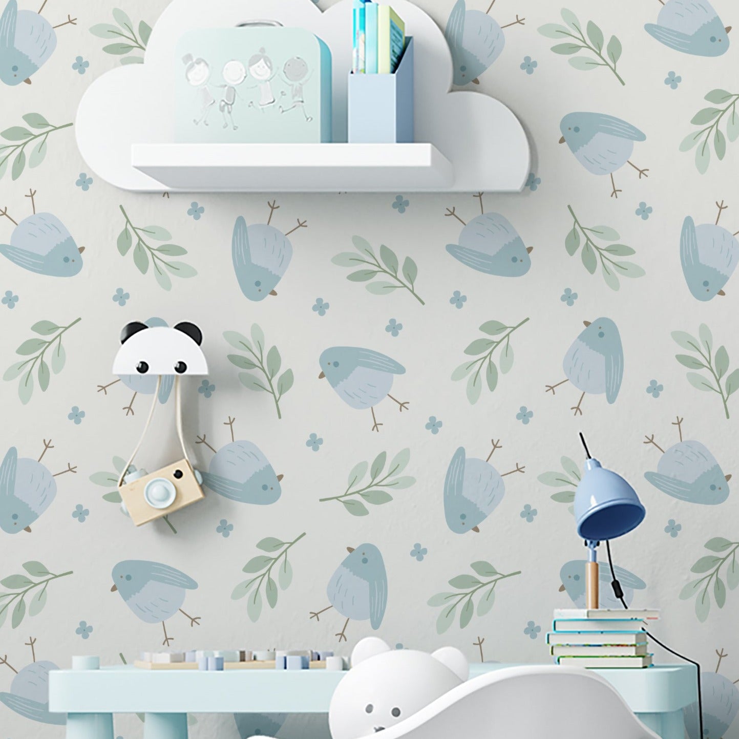 A delightful nursery room decorated with Baby Blue Bird Wallpaper, showcasing soft blue and green tones. The room features adorable children's furniture including a whimsical elephant chair and a panda lamp, creating a playful and soothing environment.