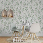 Children’s play area decorated with Easter Leaf Wallpaper, displaying a gentle pattern of light green leaves against a white backdrop, contributing to a calm and soothing environment alongside modern furnishings.