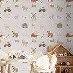 Cozy corner of a children's room showing a wall covered with 'Spring Farm Animals II Wallpaper' depicting farm animals, tractors, and rustic barns in gentle colors, enhancing the farmhouse theme with wooden toys and furniture
