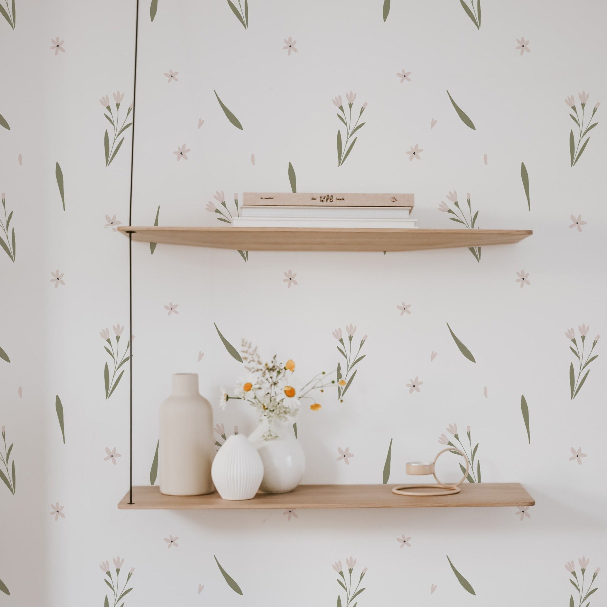 Summer Market Wallpaper in a serene living space, with subtle floral and foliage designs in pastel shades, complementing minimalist wooden shelving and modern decor, creating a fresh and inviting atmosphere.