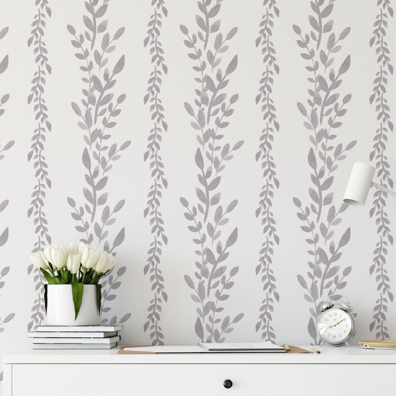 Decorative setting displaying Classic Floral Wallpaper with a bouquet of white tulips on a desk, enhancing the room’s aesthetic with its gentle gray floral patterns on a crisp white background.