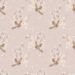 A close-up view of the 'Boho Bouquet II Wallpaper', presenting a bohemian floral pattern with blush pink flowers and gold-tinged foliage on a pastel pink backdrop. The wallpaper’s subtle tones and artistic design convey a tranquil, romantic atmosphere.