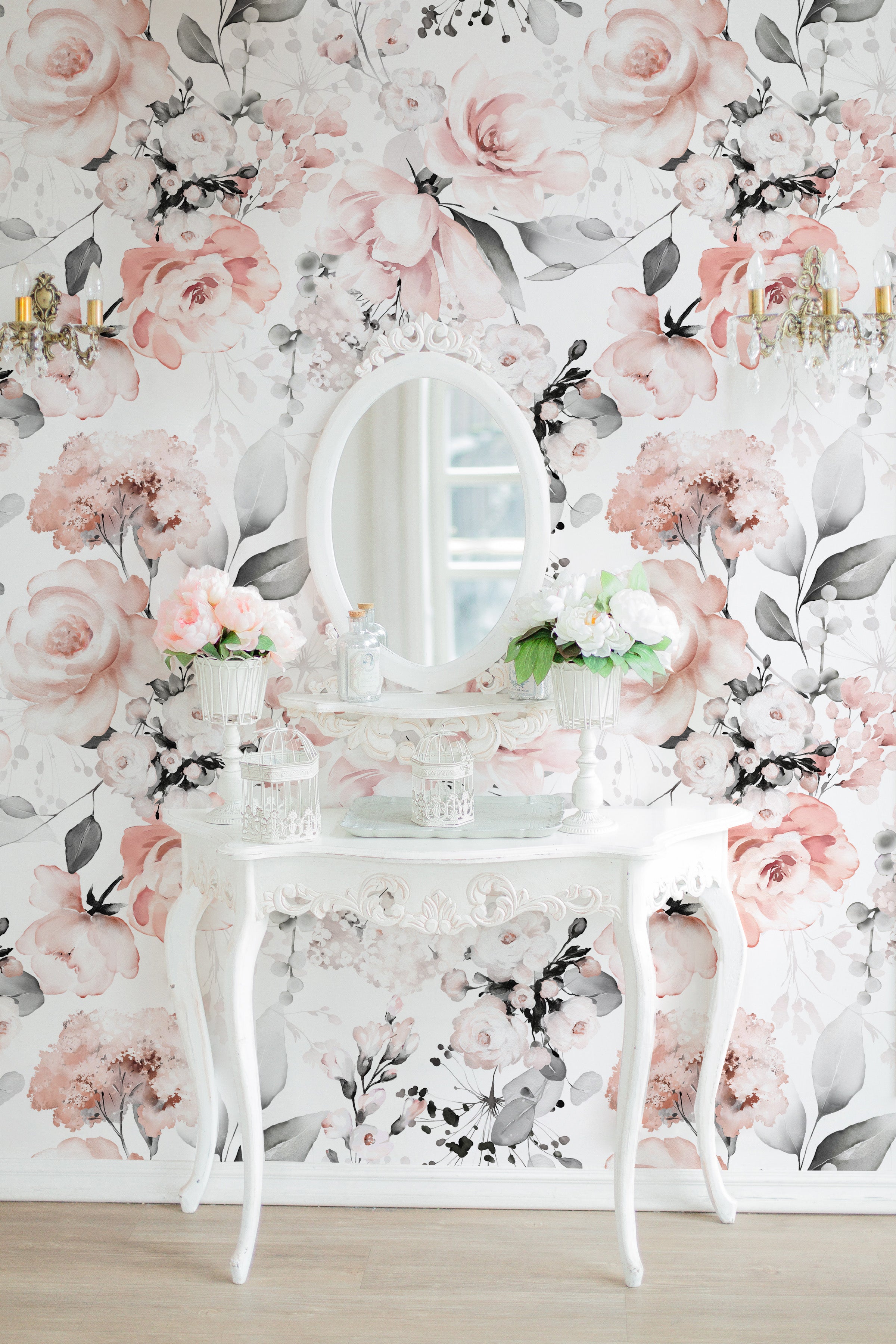 An elegant dressing area accentuated by the 'Floral and Herbs Wallpaper - Pink + Black - 50"', with a classic white vanity table and mirror. The surrounding floral wallpaper with large pink blooms and dark herbal accents creates a charming and feminine backdrop that enhances the room's sophistication.