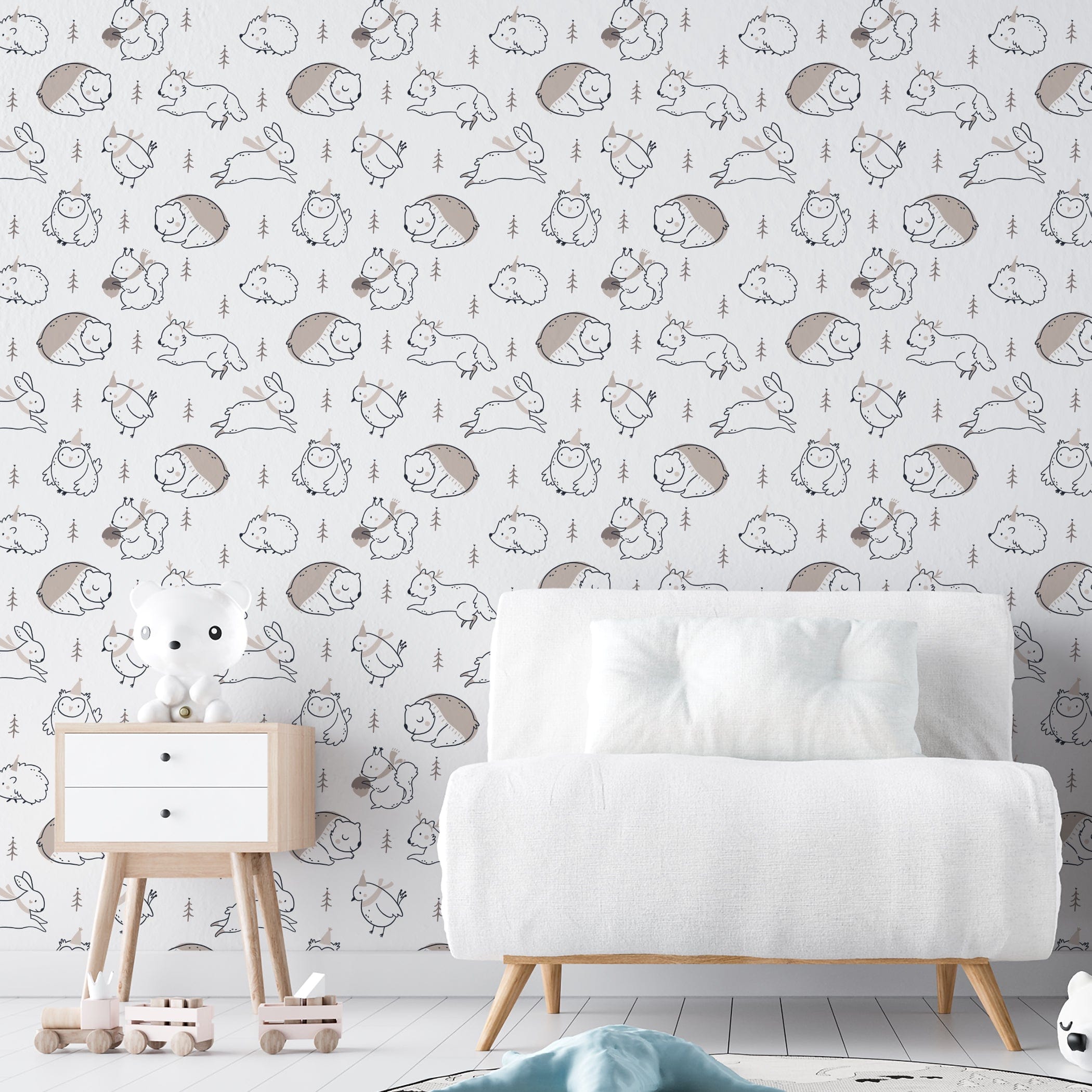 Winter Friends Wallpaper decorating a children's room, showing whimsical woodland creatures in soft neutral colors with playful accessories, enhancing a modern nursery setup with a white crib and simple wooden furniture