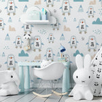 A playful children's room decorated with "Nordic Penguin Wallpaper," featuring a pattern of adorable cartoon penguins and small geometric mountain shapes in shades of blue, beige, and gray. The room is equipped with a white tent, children's furniture, and whimsical toys like a large elephant and rabbit figures, creating a fun and engaging atmosphere.