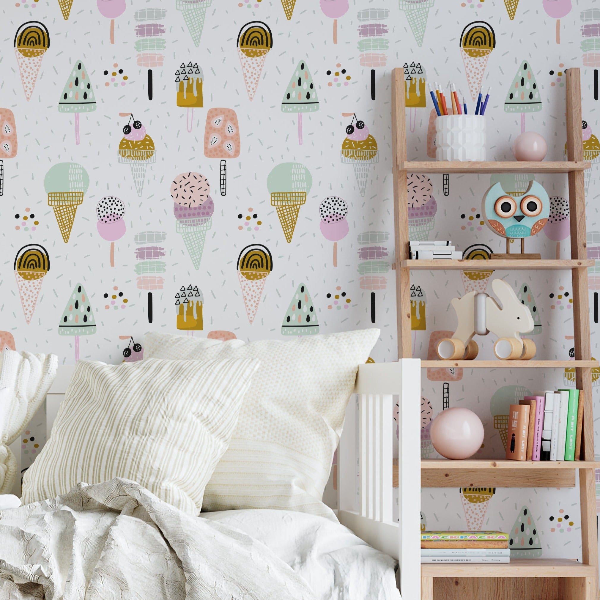 Children's bedroom showcasing walls adorned with playful ice cream cone and popsicle wallpaper in pastel colors, complementing a cozy corner filled with plush toys, books, and wooden shelving for a fun and inviting atmosphere.