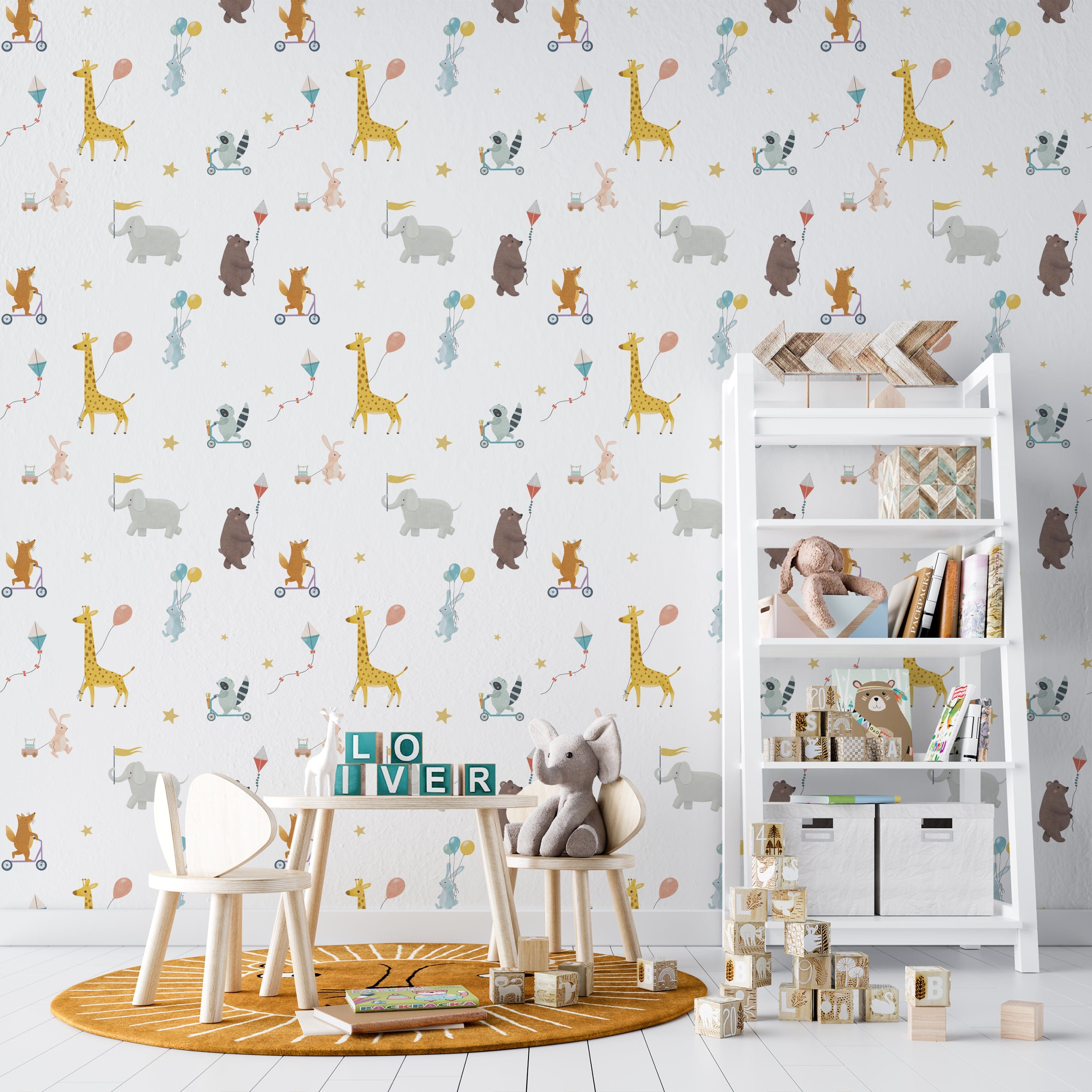 A child's room decorated with the Adventure Wallpaper, showcasing a lively and fun atmosphere. The wallpaper provides a backdrop to a simple wooden table and chairs, with a plush elephant toy on one chair, emphasizing the room's whimsical and youthful theme.