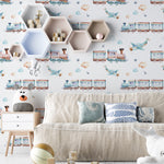 A cozy room setup displaying 'Trains and Planes Kids Wallpaper III,' which decorates the walls with whimsical trains and airplanes. The soft colors and playful imagery make it ideal for a child's bedroom, providing a backdrop that inspires dreams of sky-high adventures and rail journeys.