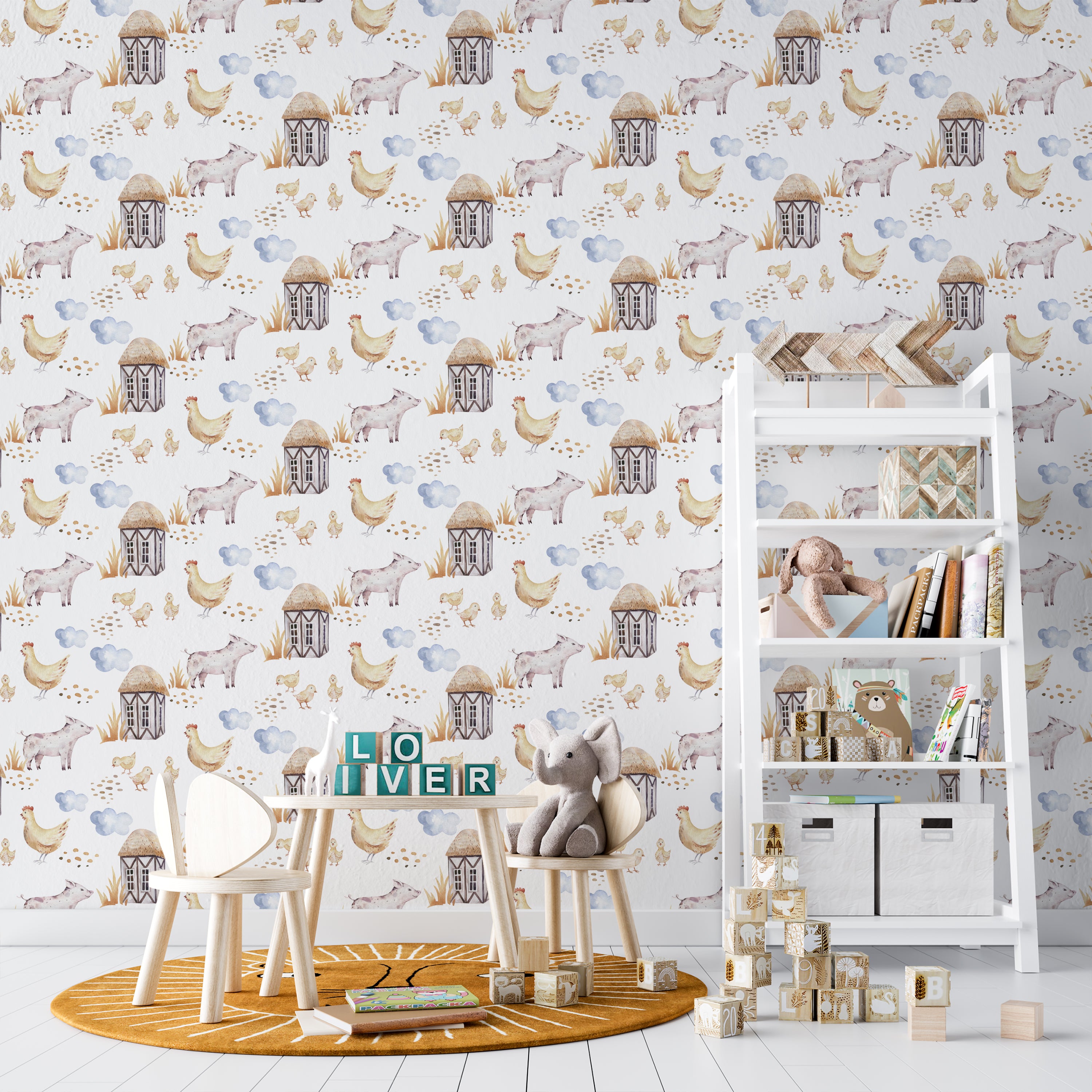 A cozy nursery showcasing walls covered with 'Watercolor Farm Animals' wallpaper. The wallpaper features a serene farm scene with chickens, pigs, farmhouses, and clouds. The room is furnished with a white shelf filled with children's books and toys, enhancing the room's warm and inviting atmosphere
