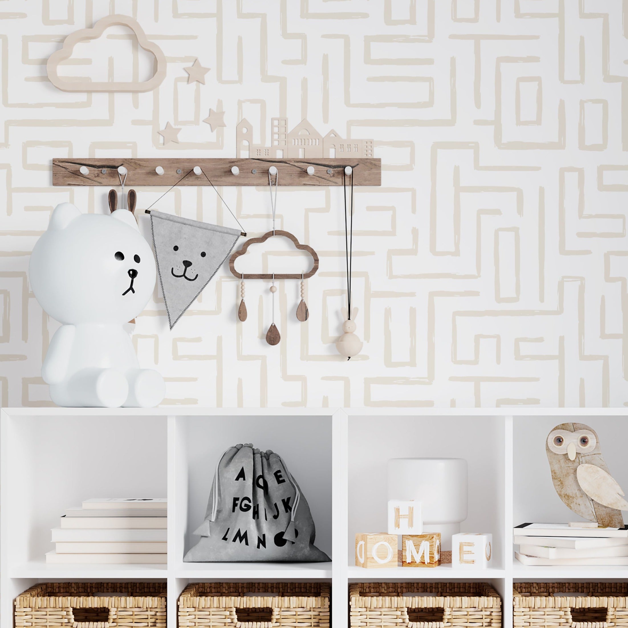 A stylish nursery room wall covered with Organic Wallpaper 19 Ecru, featuring an intricate maze pattern in a gentle ecru shade. The room is accessorized with a children's shelf displaying toys and decorative items, enhancing a playful yet sophisticated space.