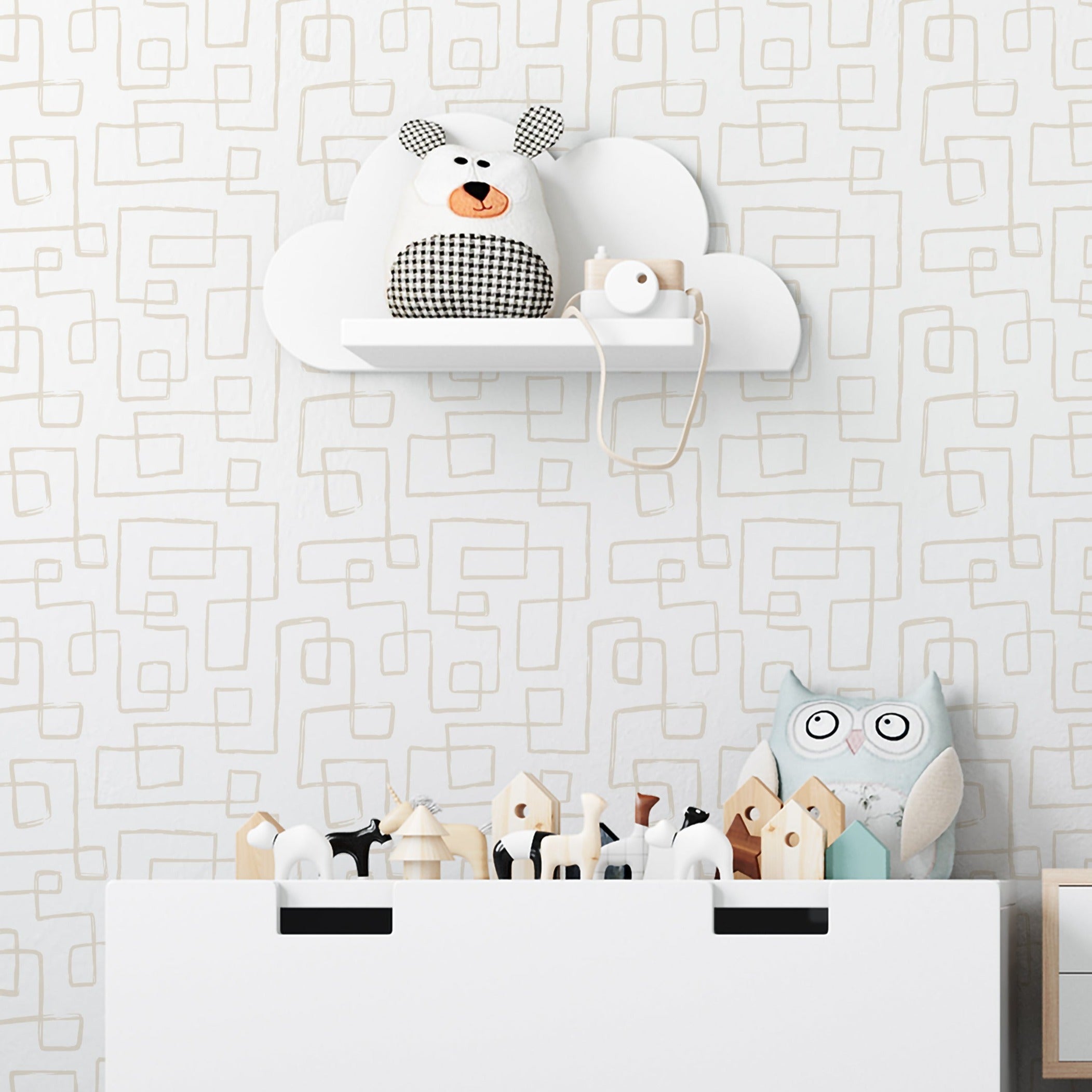 Children's nursery with playful and modern design, featuring a large white toy storage bin with various stuffed animals and a whimsical cloud-shaped shelf on a patterned wallpaper background. The wallpaper has a subtle, abstract geometric pattern in a neutral color palette