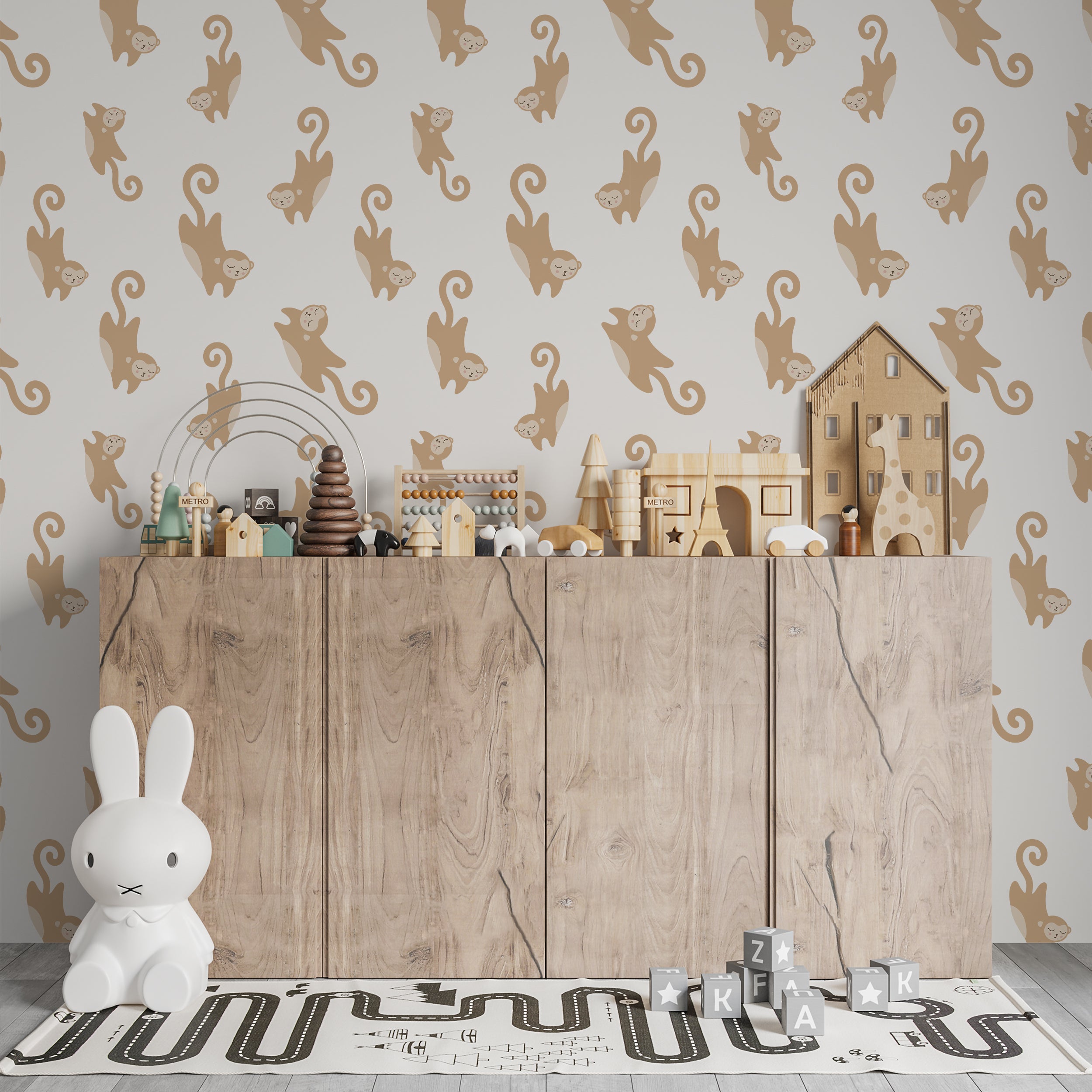 A children's playroom wall adorned with Cute Monkey Wallpaper, creating a lively and fun atmosphere. The wallpaper's beige and taupe monkey designs contrast beautifully against the wooden toy storage and colorful toys.