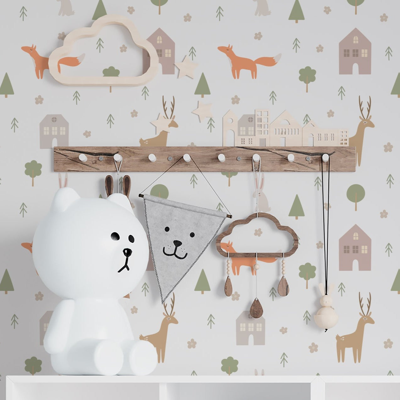 Children's room decorated with Stag and Fox Wallpaper enhancing the playful and whimsical atmosphere. The wallpaper includes motifs of stags, foxes, and forest elements, complementing the room's natural wood furniture and playful toys.