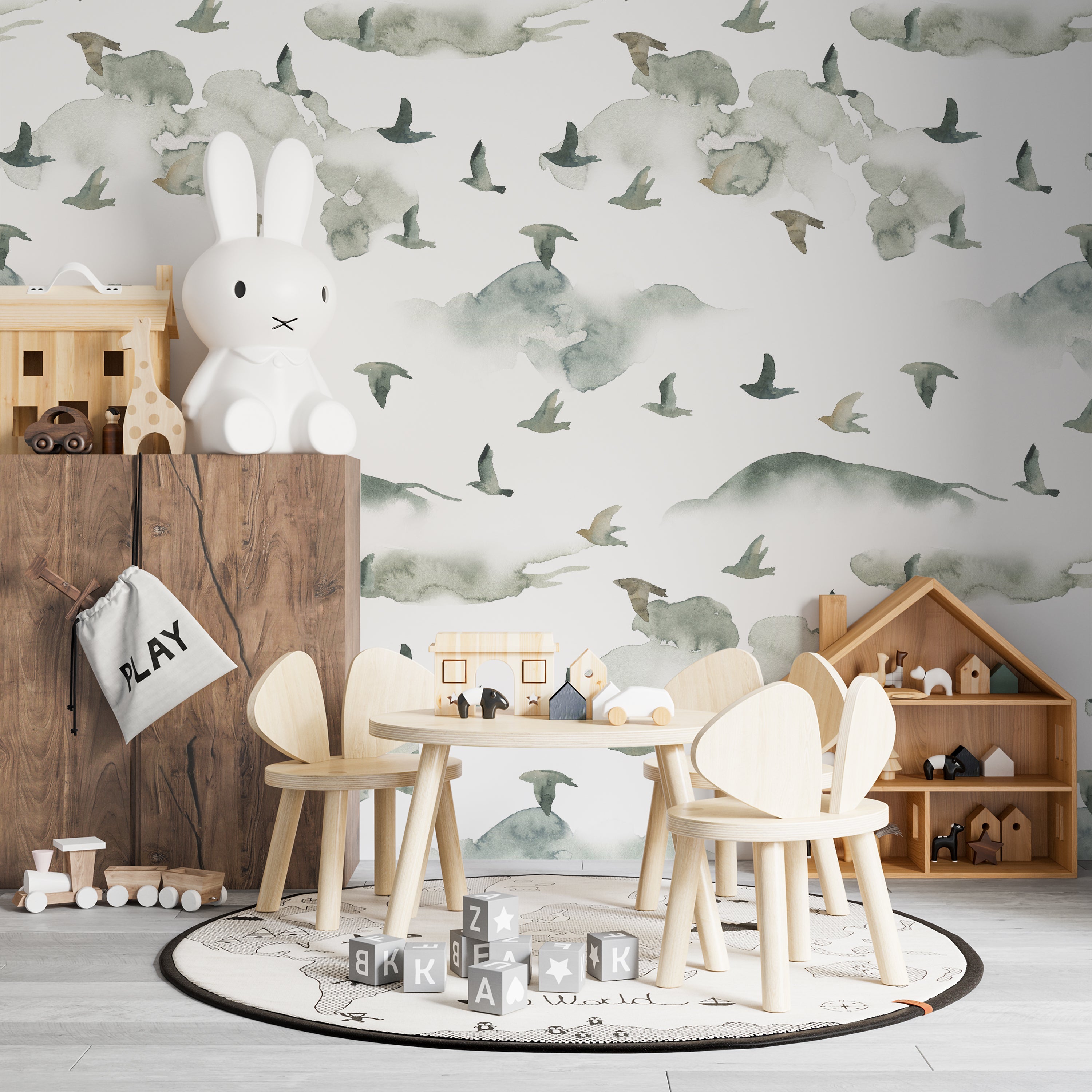 A child's playroom with the "Wild Pinery Wallpaper" adorning the walls, creating a whimsical backdrop for play and imagination. The wallpaper's subtle depiction of a forest with birds in various poses complements the room's wooden toys and furniture, enhancing the space with a sense of outdoor adventure.
