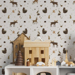 Children's room adorned with Deer and Bear Wallpaper, creating a lively and engaging atmosphere. The wallpaper features charming illustrations of deer and bears surrounded by nature, complementing a room filled with toys and child-friendly furniture