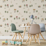 A children's playroom decorated with Farm Friend Wallpaper - Happy Goslings, showcasing charming illustrations of houses, trees, tractors, geese with goslings, and grass, creating a playful and cozy atmosphere.