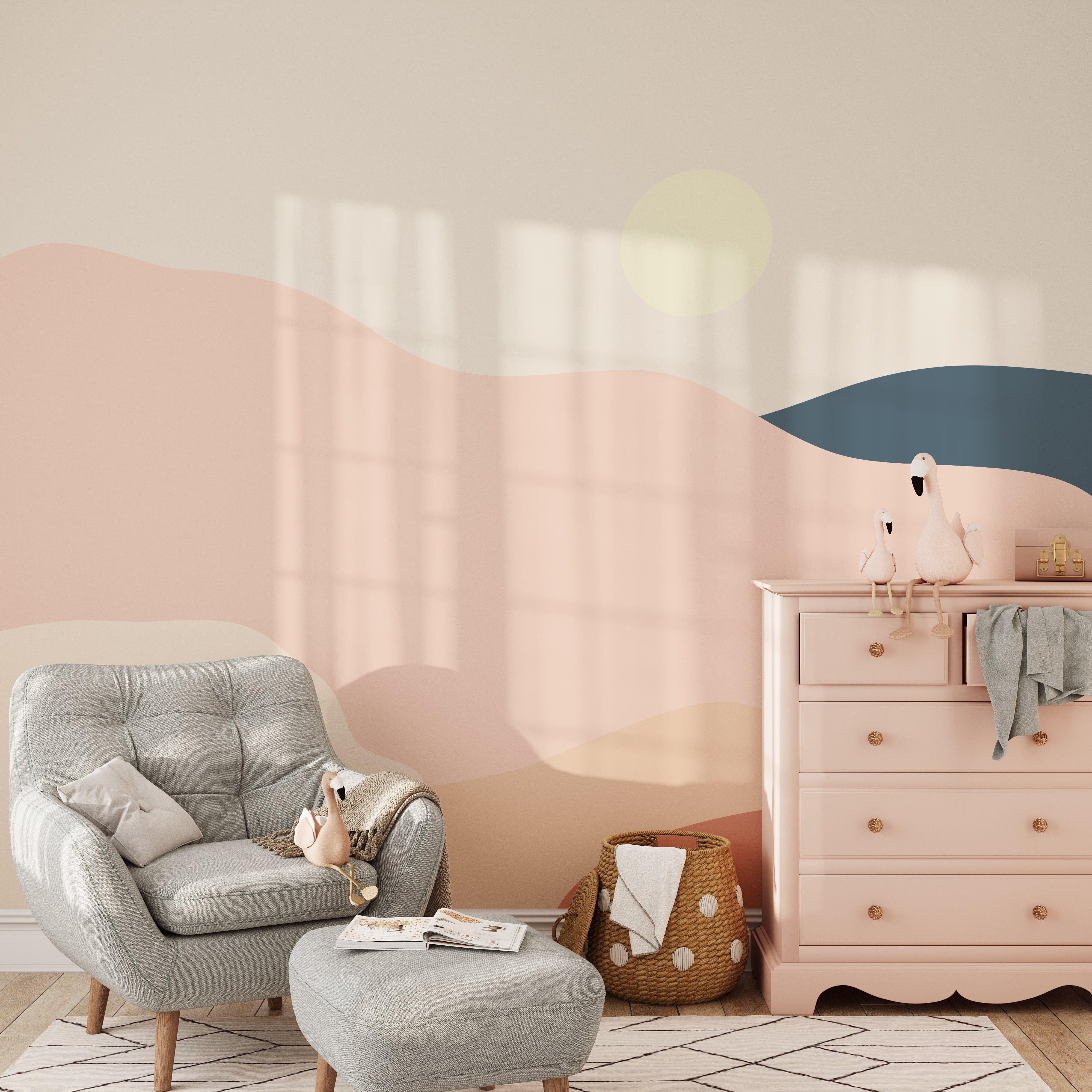 Pastel Playground Kids Mural Wallpaper in a cozy nursery setting, featuring a gray armchair with a matching ottoman, a pink dresser, and decorative toys, creating a serene and playful atmosphere