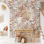 Interior view with a feature wall covered in Neutral Modern Floral Mural wallpaper. The design displays a harmonious blend of large-scale flowers and leaves in neutral tones, complementing the minimalist and cozy decor of the room.