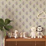 A children’s room corner with the Peaceful Floral Bouquet Wallpaper creating a whimsical and nurturing environment. Wooden toys and child-friendly decor items rest atop a rattan cabinet, harmonizing with the wallpaper's soft floral design.