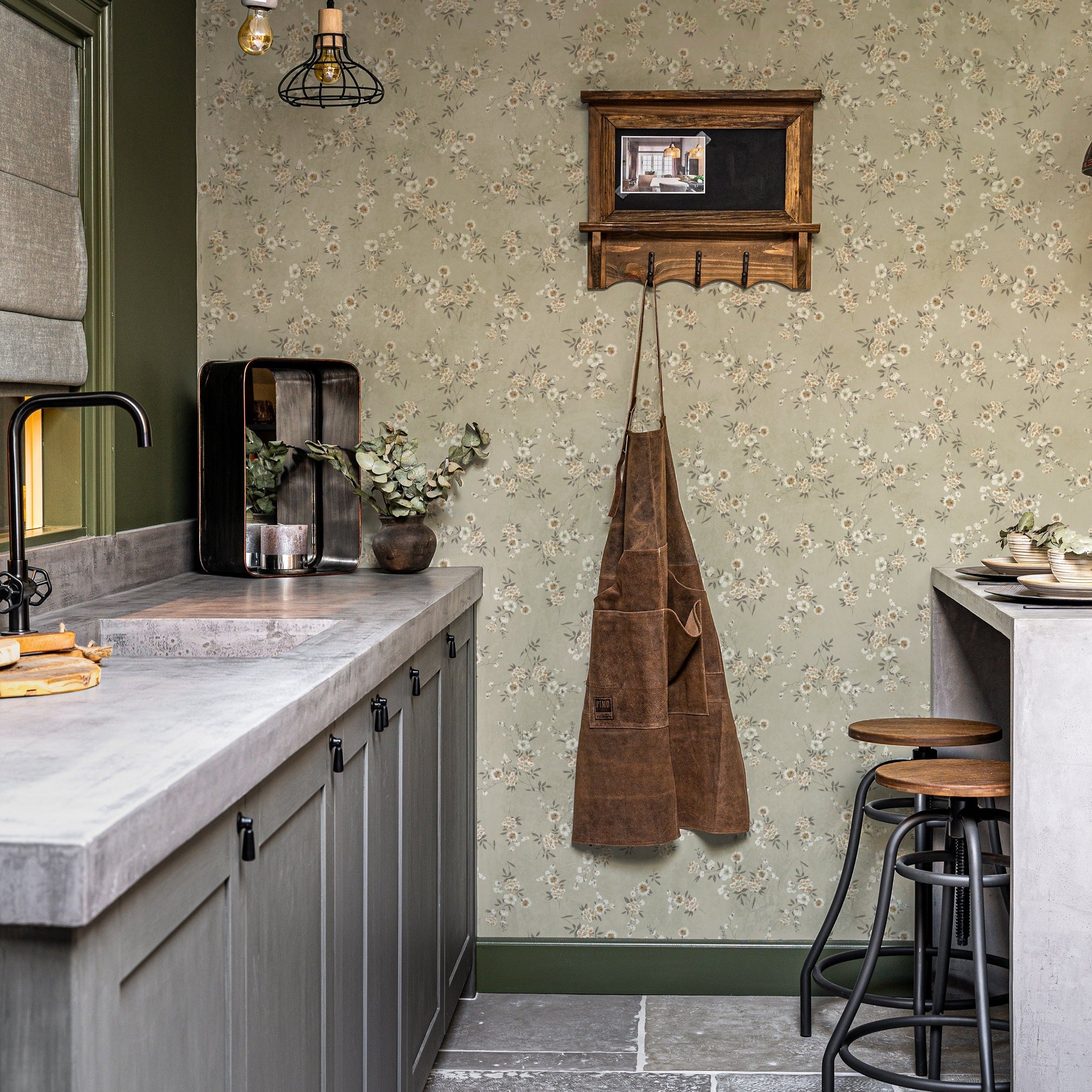 A close-up of the Classic Floral Wallpaper in a kitchen setting, emphasizing the wallpaper's ability to blend seamlessly with modern and vintage elements. The earthy green tones and floral pattern create a warm and welcoming ambiance, harmonizing with the kitchen’s contemporary fixtures and natural accents.
