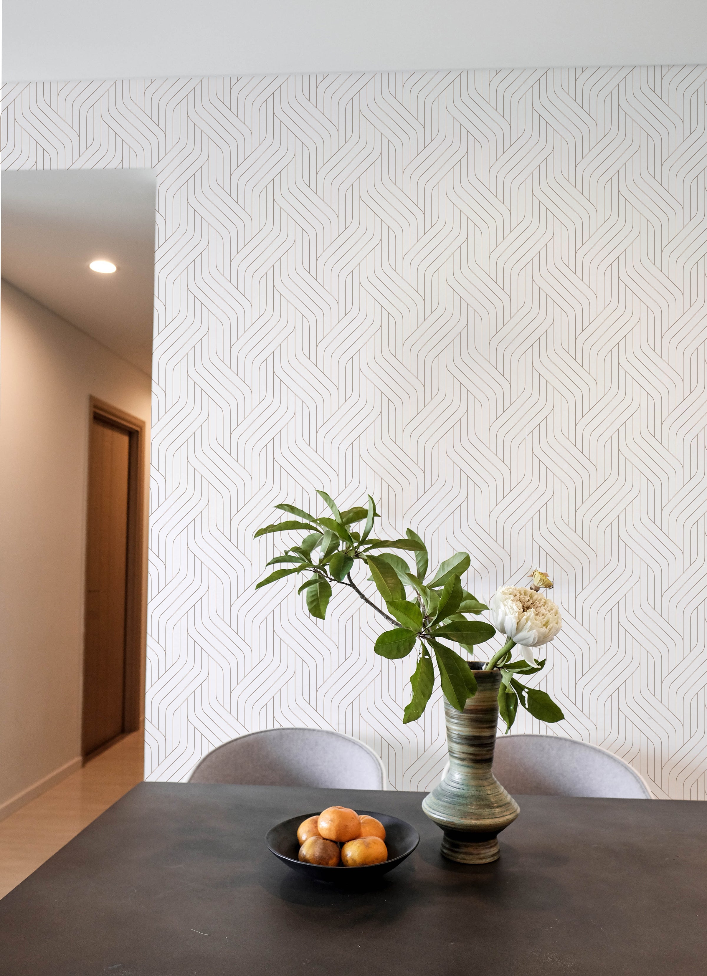 Modern Braids Wallpaper in a dining room setting with a vase of greenery and fruit bowl on the table