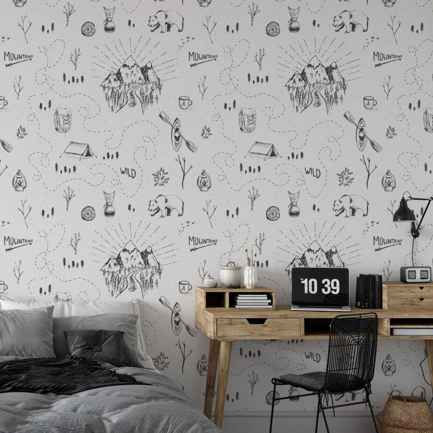 The Big Adventure Kids Wallpaper is featured in a cozy bedroom setup with a modern wooden desk and stylish decor, infusing the space with a sense of adventure through its charming and intricate line drawings of wilderness scenes.