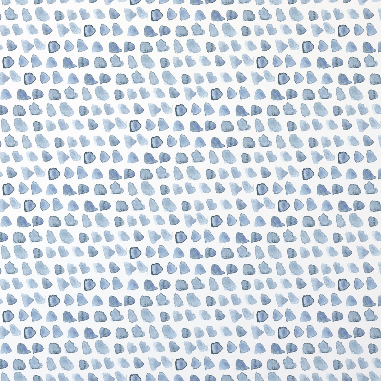 A detailed view of the Hand Painted Dots Wallpaper - Blue, showcasing an array of blue watercolor dots in various shades and opacities against a white background, creating a playful and organic pattern.