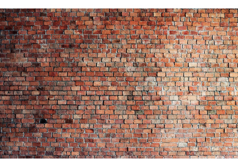 A close-up view of the Realistic Red Brick Wallpaper showcasing the detailed texture and varied shades of red and brown bricks with white grout lines, giving a warm and authentic urban look.