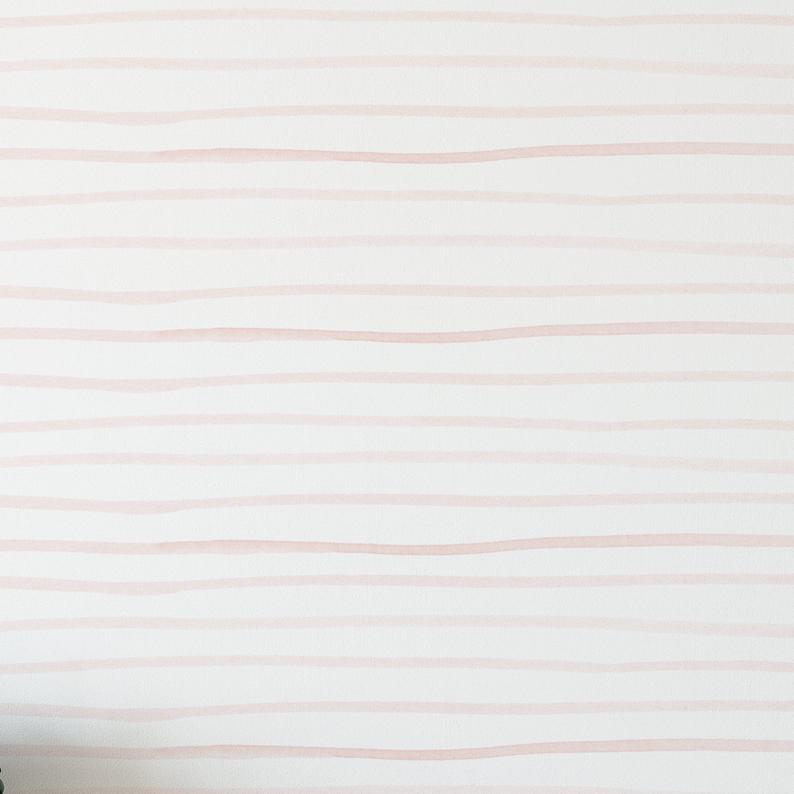 Close-up of Minimal Brush Stroke Wallpaper - Blush showcasing soft, hand-painted blush pink brush strokes on a white background, creating a minimalist and serene design.
