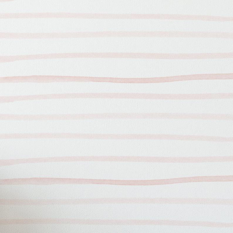 Close-up of Minimal Brush Stroke Wallpaper - Blush showcasing soft, hand-painted blush pink brush strokes on a white background, creating a minimalist and serene design.