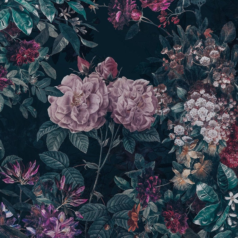 An intricate Dark Luxury Floral Wallpaper - Large adorns a wall with lush, overscaled flowers in deep blues and purples, accented with touches of pink and red, against a dark background, giving a dramatic and opulent touch to the interior space