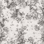 Close-up of the Toile De Jouy Monochrome Floral Wallpaper, displaying intricate sketches of various flowers and foliage in grayscale, offering a classic and timeless design.